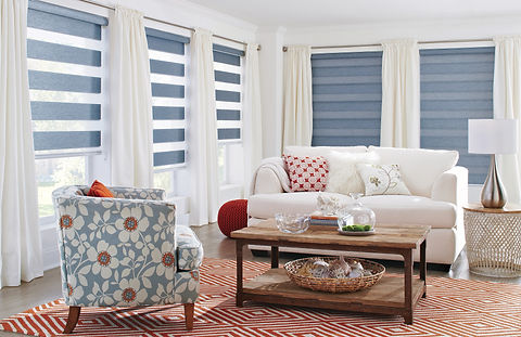 Blue-grey dual shades also known as banded shades in a casual sitting room.