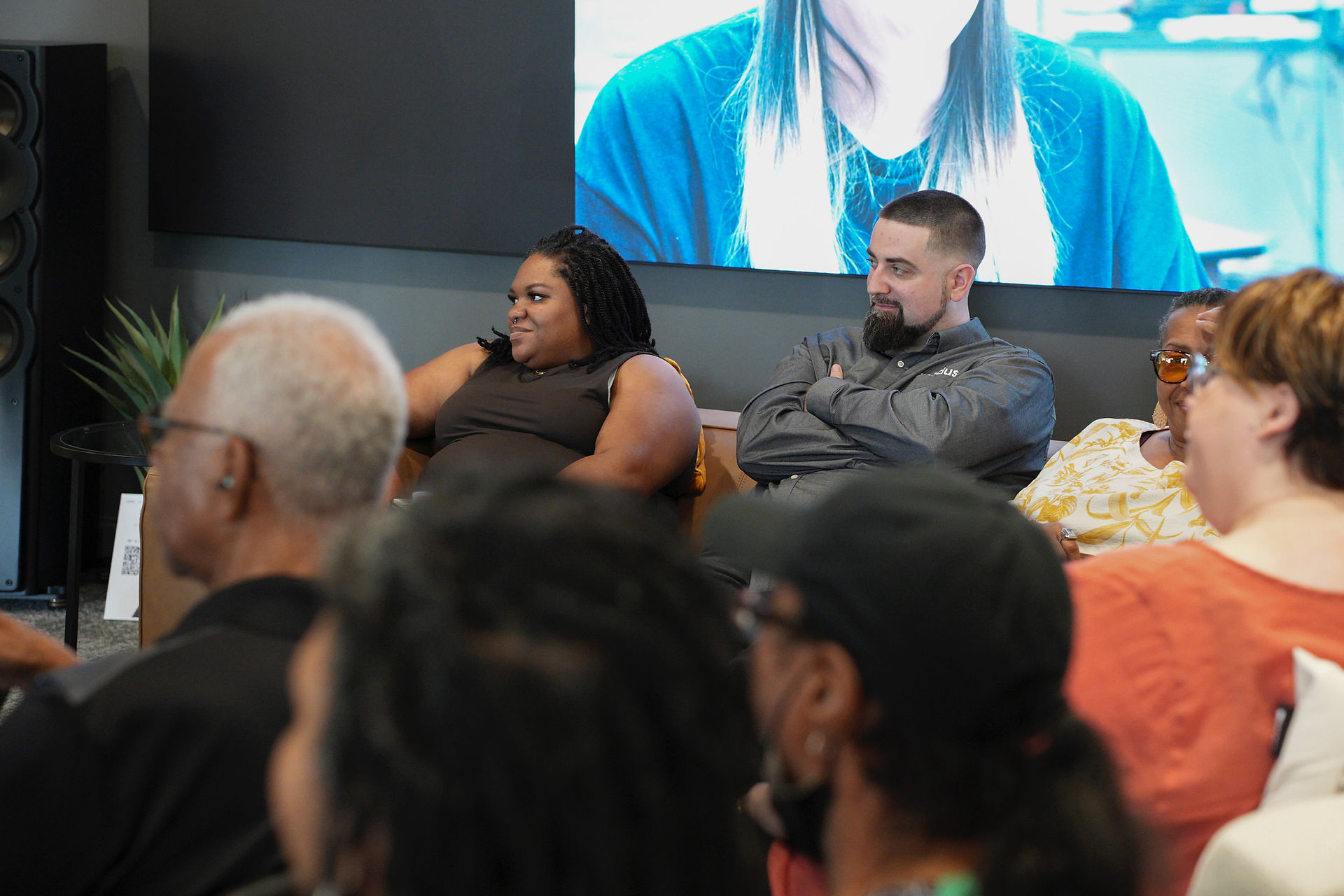 Attendees sitting on the couch
