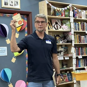 Me holding up my paperback edition of Lady Chatterley's Lover at Book People bookstore