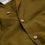 Thumbnail: Detailed view of coconut buttons and organic cotton fabric, dyed naturally with botanical dyes.