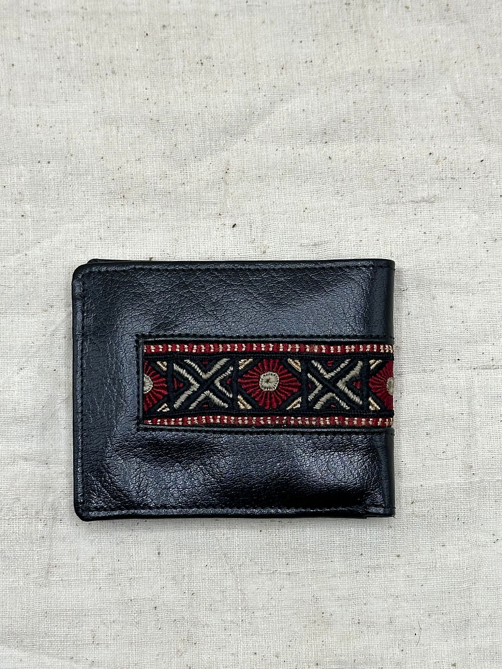Thumbnail: Leather wallet with tribal embroidery