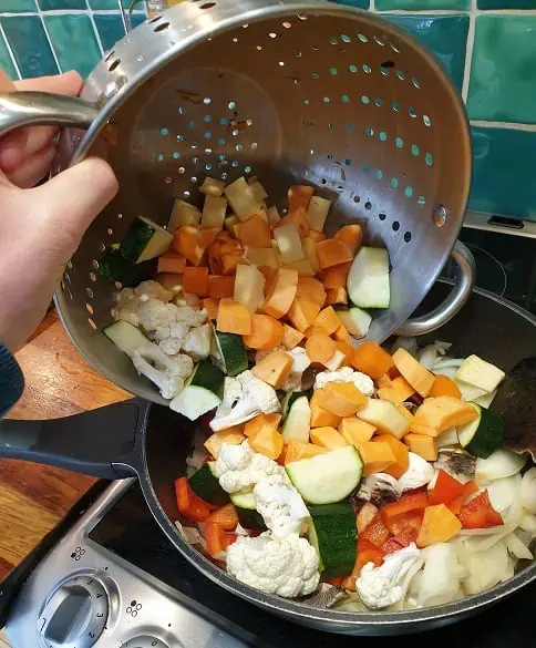 Add vegetables to Moroccan Vegetable Tagine