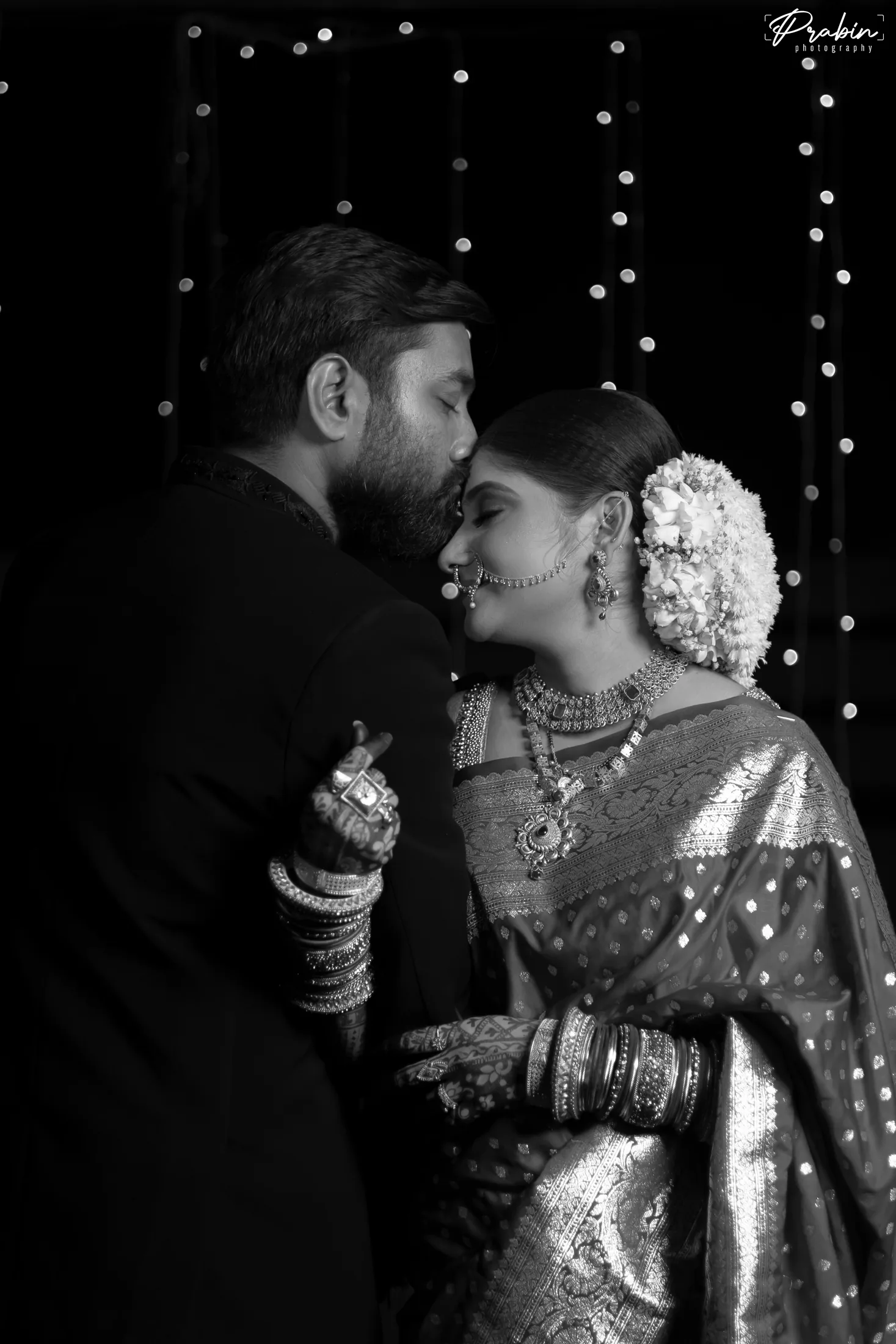 Black and white close portrait of a newlywed couple