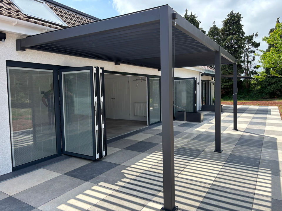 Spacious garden patio area with large bifold doors and living area.