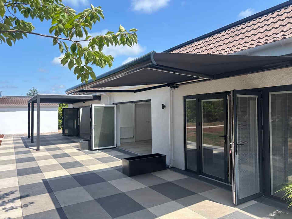 Accessible patio area with levelled outdoor access and retractable awning.