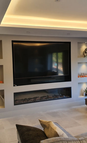 Living room with an on-trend media wall with built-in lighting.