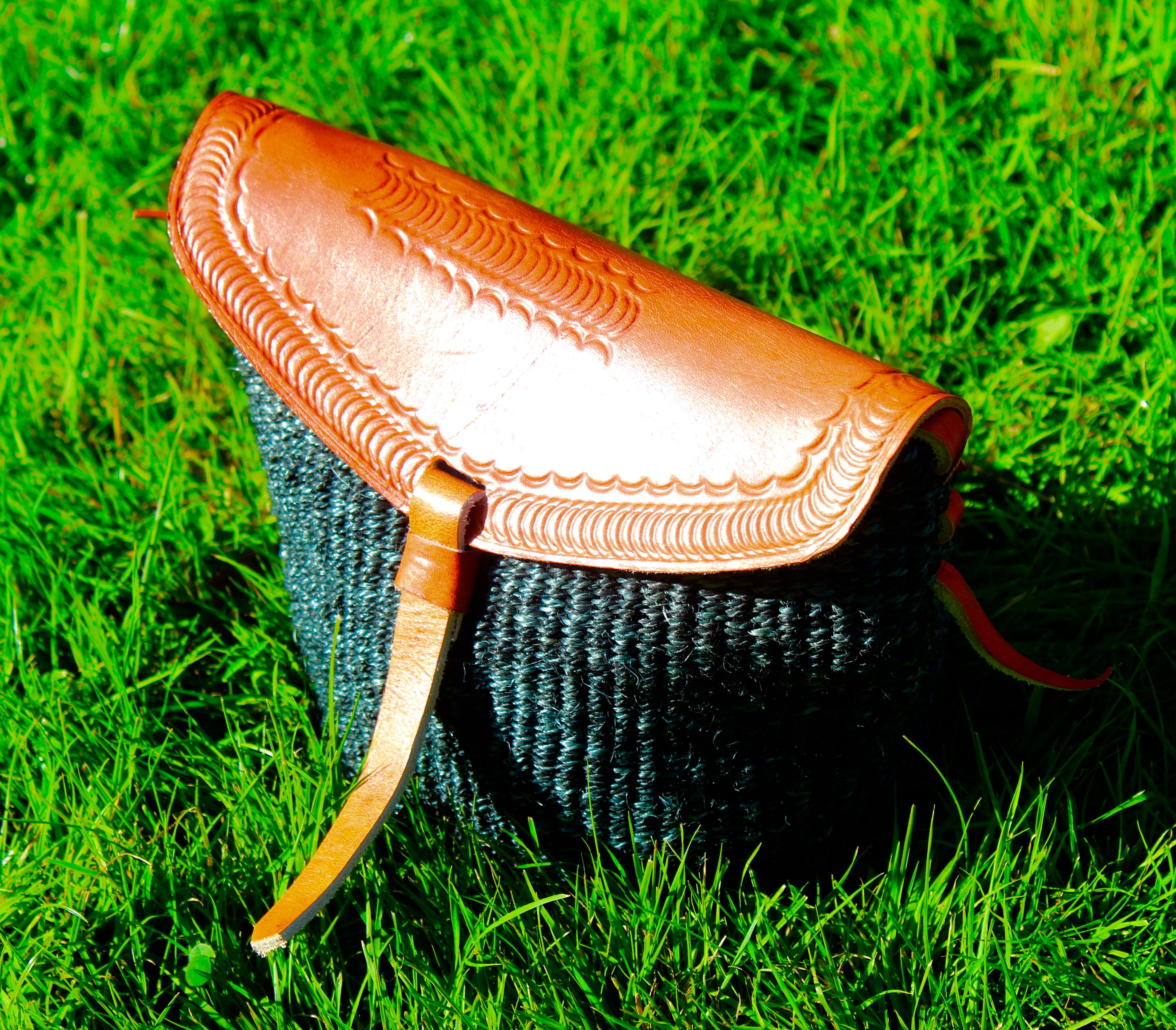 Green sisal and leather sling bag