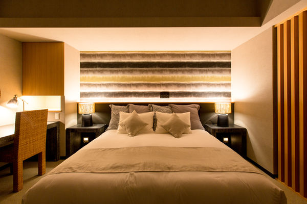 Contemporary furniture and spacious master bed room.