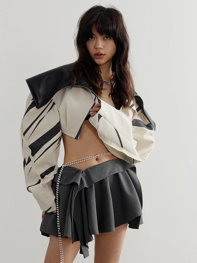 Beige and black streetwear cropped jacket with turn-down collar and zipper closure for a modern, urban look.