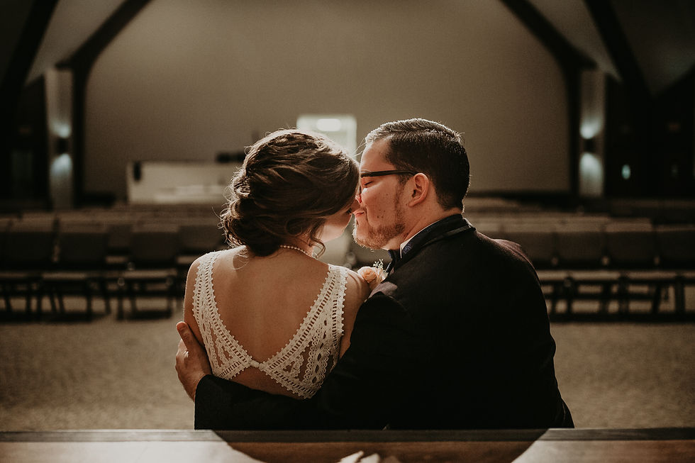 Wedding Couple in church chapel kissing