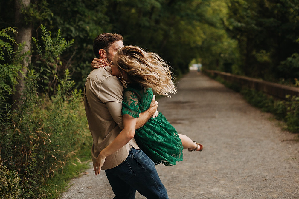 engagement session guy spinning girl