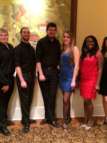 Group of people, smiling, posing for photo, formal attire, ballroom dancing