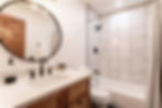 Modern bathroom remodel gallery featuring white marble tile.