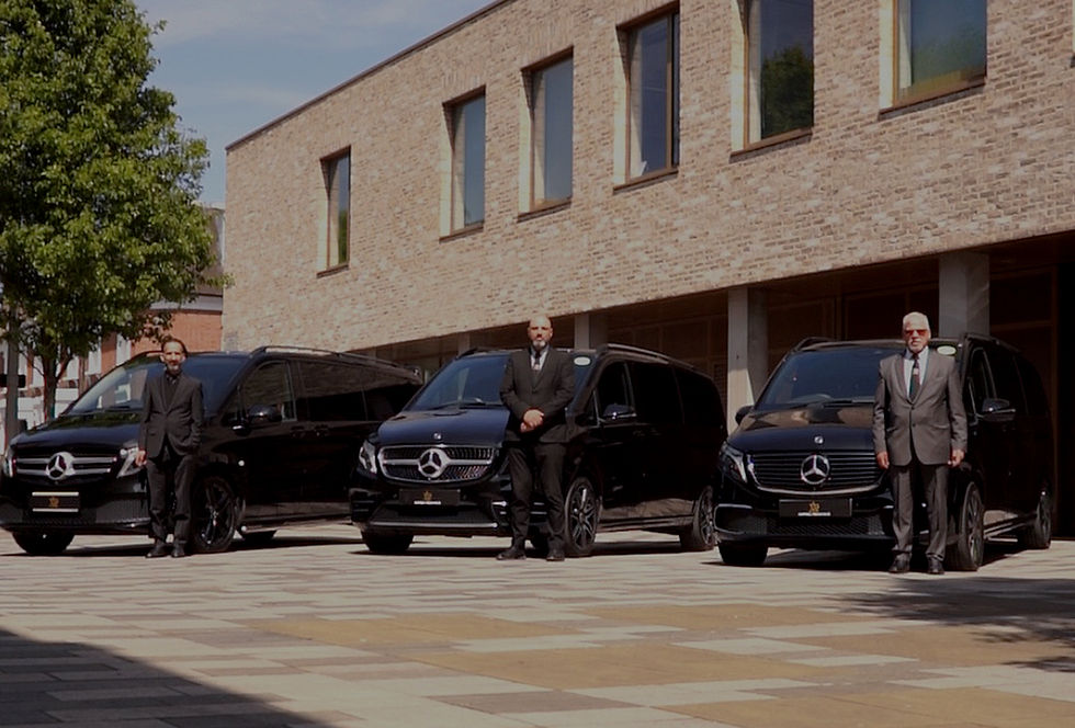3 mercedes vito cars with 3 professional driver stood outside the car with buildings in the background
