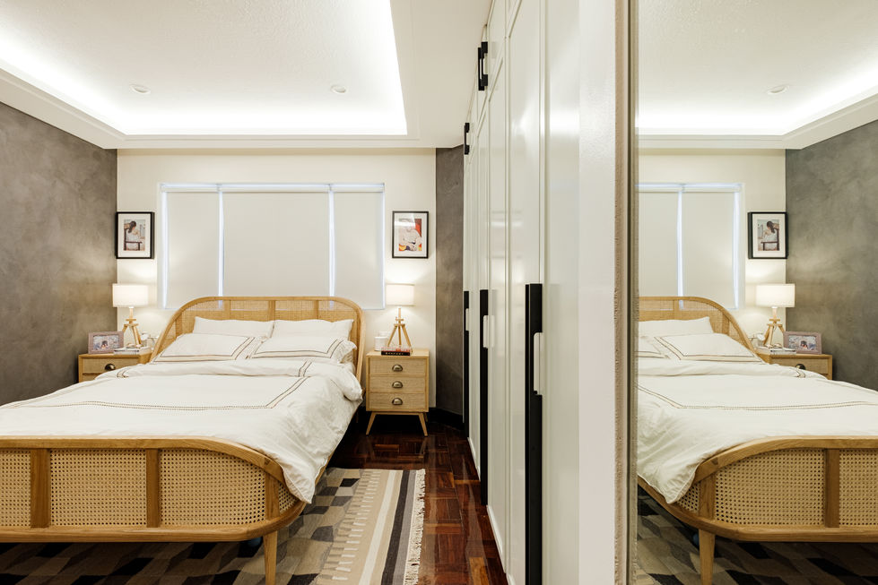 Modern bedroom with wooden bed and mirrored wardrobe.