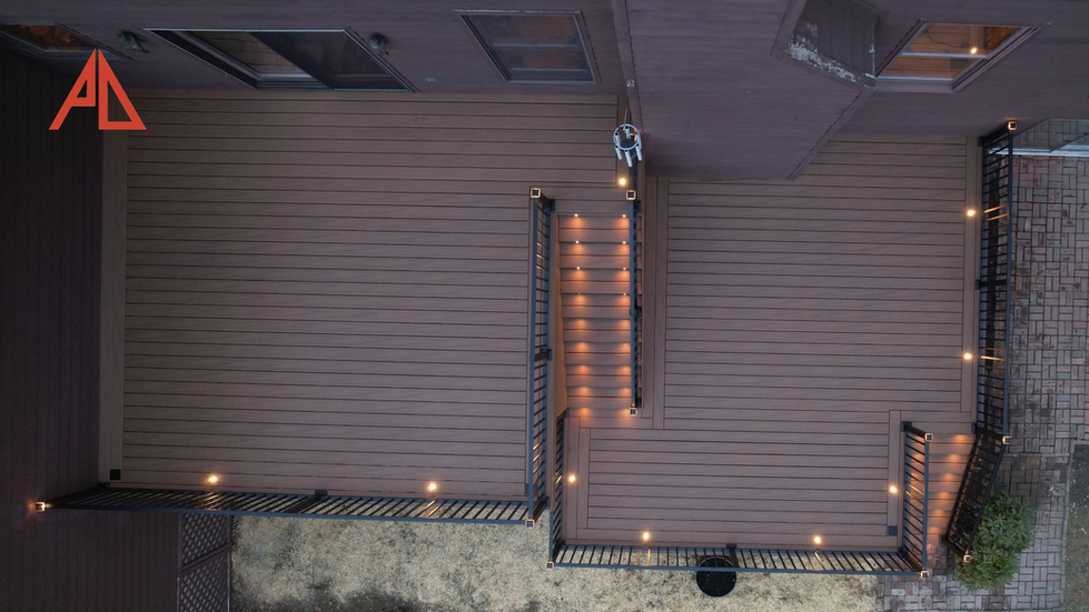 "Evening ambiance on a Pinnacle-crafted Trex® deck with strategic lighting for perfect outdoor moments.