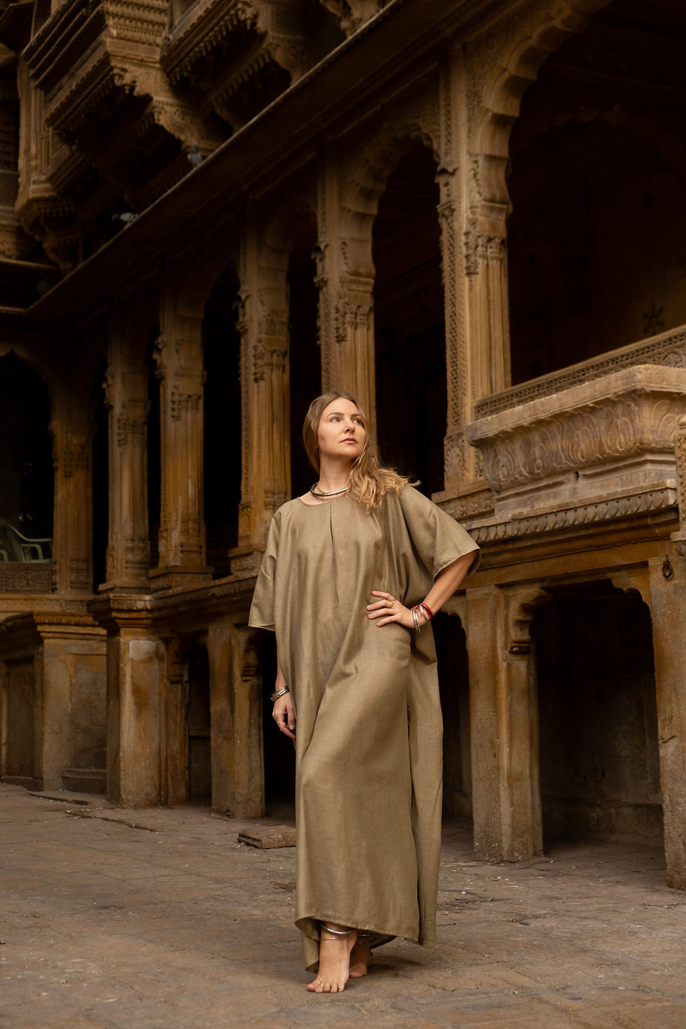 Thumbnail: Model wearing Ashvatha Ecowear olive green tunic in Ahimsa silk.