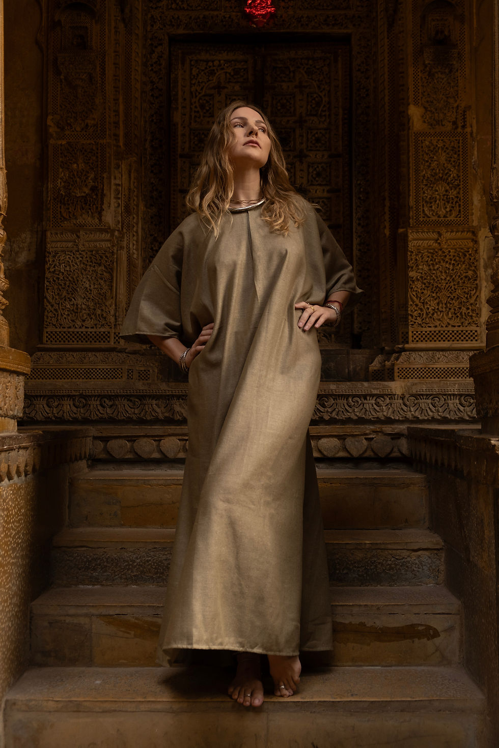 Thumbnail: Model wearing Ashvatha Ecowear olive green tunic in Ahimsa silk.