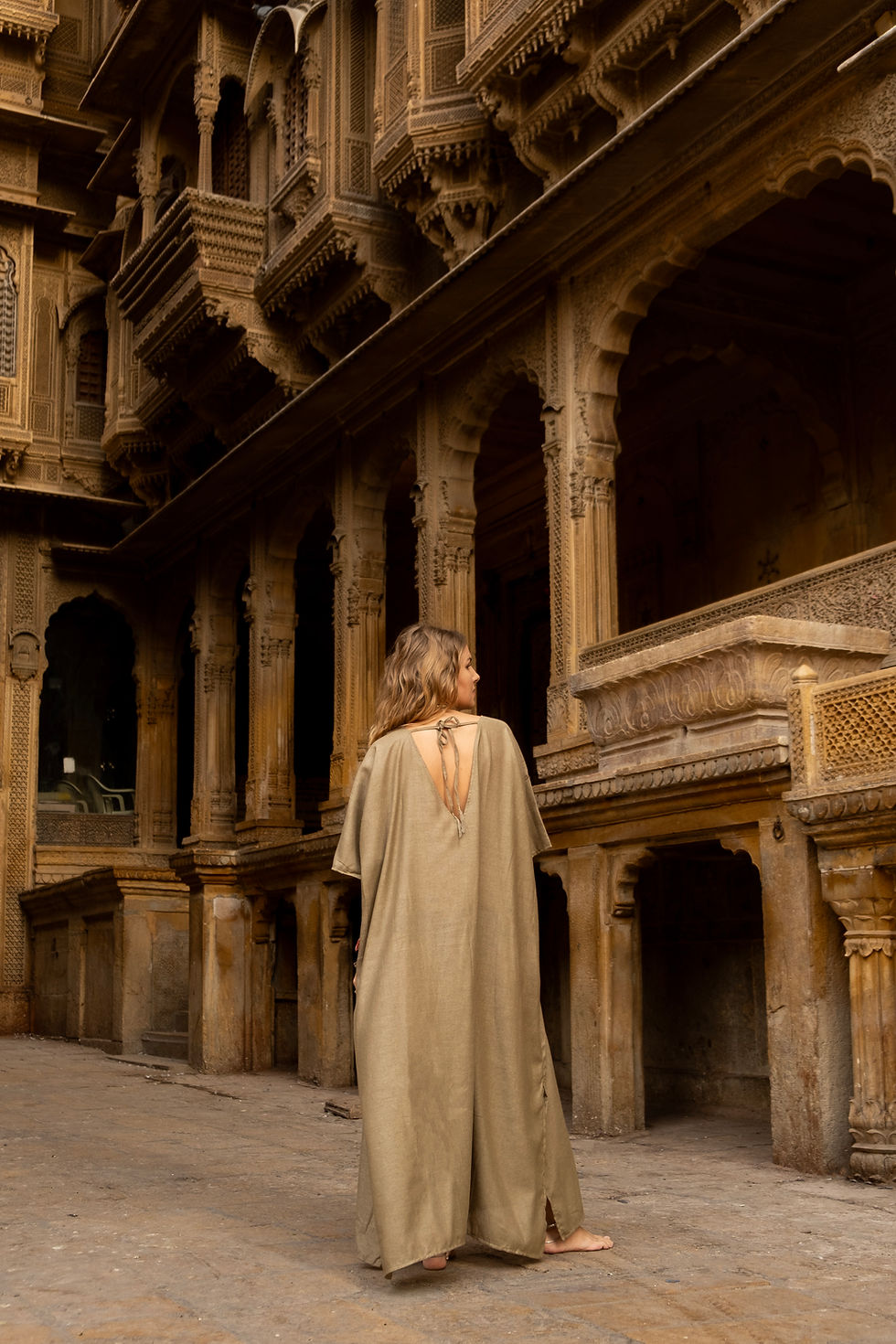 Thumbnail: Model wearing Ashvatha Ecowear olive green tunic in Ahimsa silk.