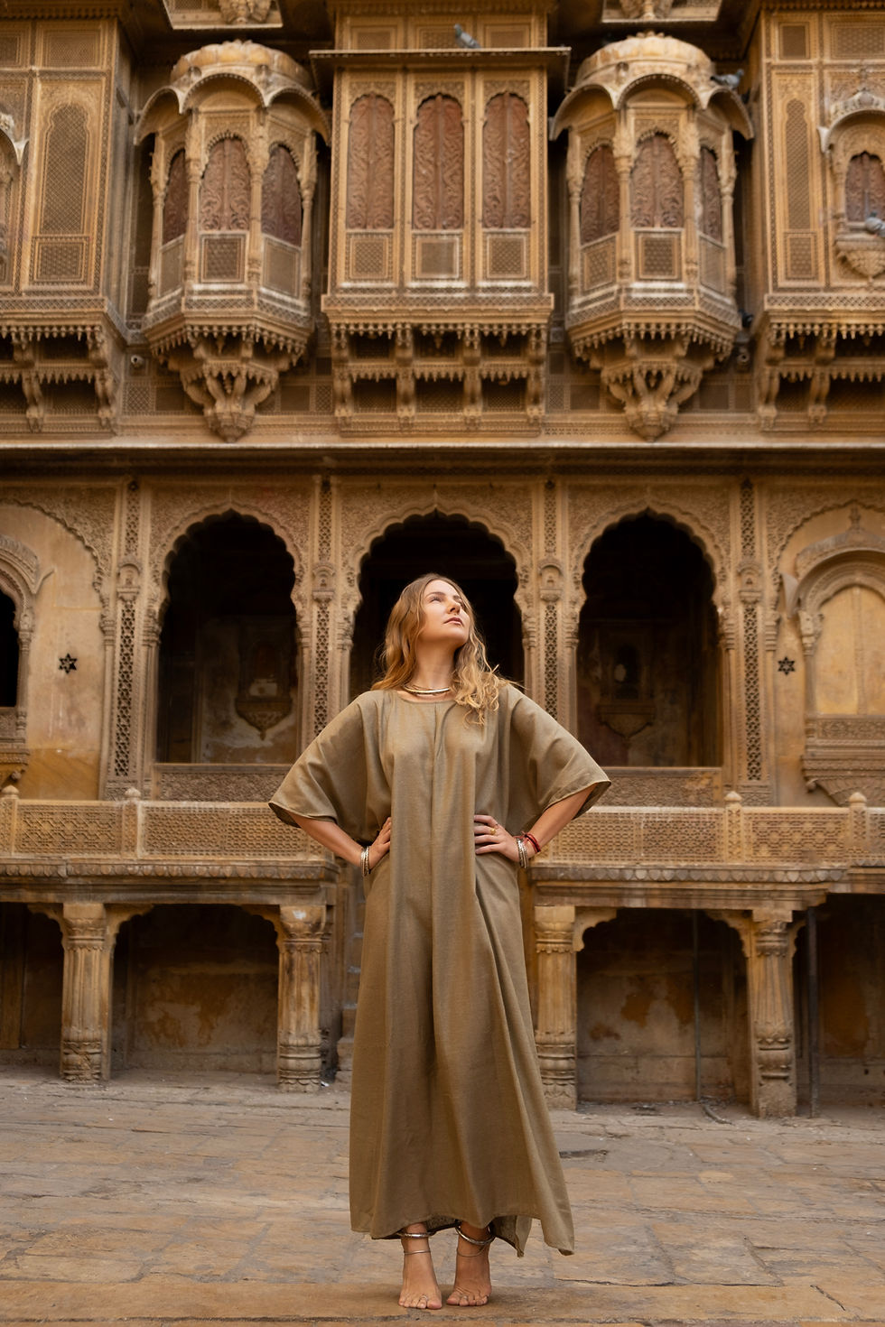 Thumbnail: Model wearing Ashvatha Ecowear olive green tunic in Ahimsa silk.