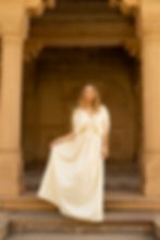 Model wearing Ashvatha Ecowear beige ceremonial goddess gown in Ahimsa silk with flowing maxi silhouette
