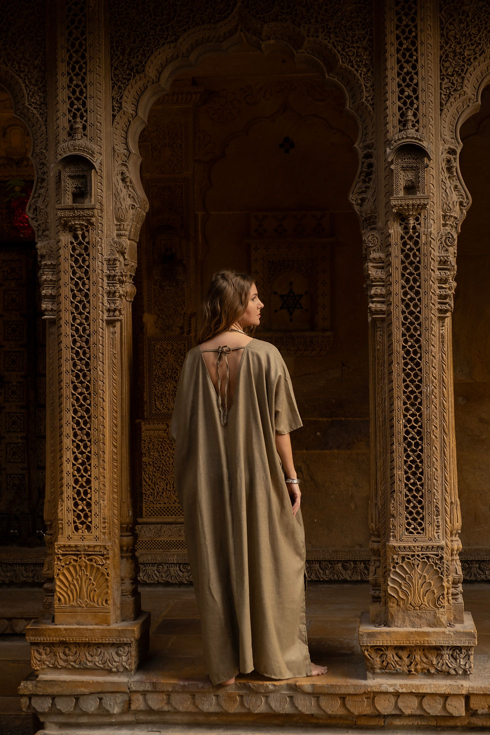 Thumbnail: Model wearing Ashvatha Ecowear olive green tunic in Ahimsa silk.