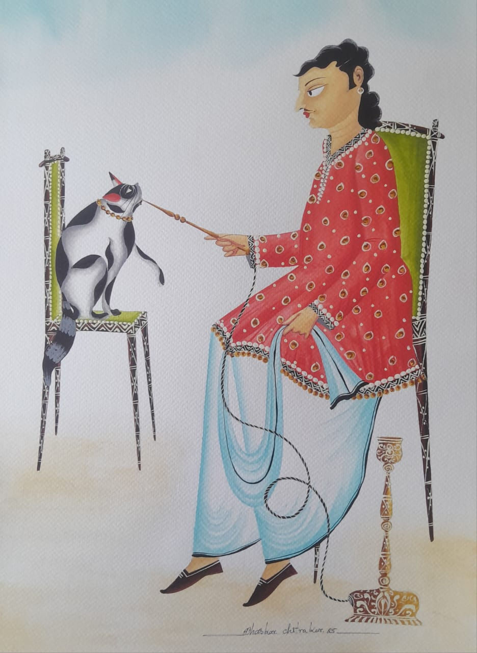 Babu sitting with a cat