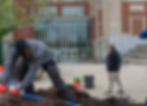 Volunteers working together during Impact League community service