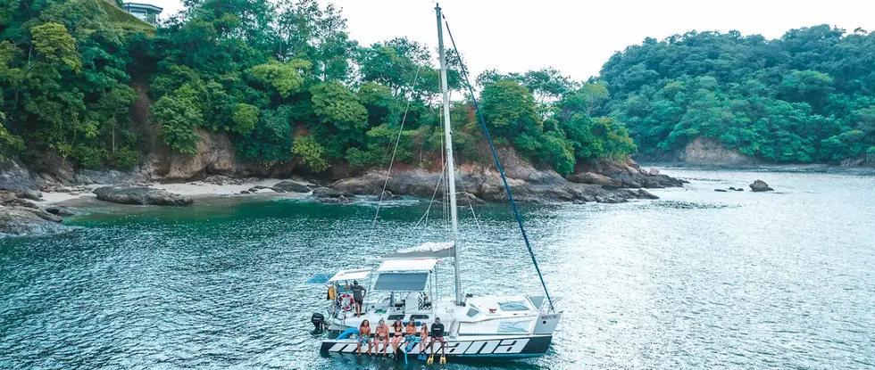Mowana trimaran anchored in a peaceful bay along the Guanacaste coast of Costa Rica
