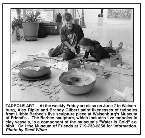 Children working with pastels in art workshop