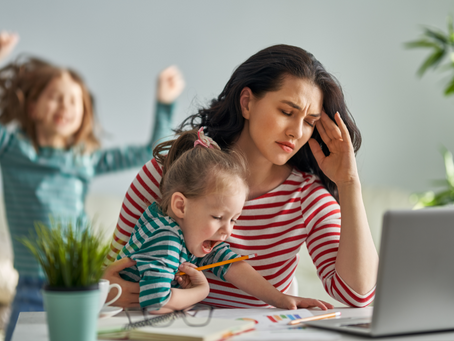 Mother working from home with kids