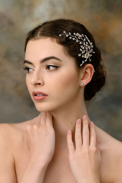 Embrace the fairy-like charm with this exquisite accessory. With its ethereal sparkle and feather-light design, this headpiece gracefully dances upon your hair, bestowing an enchanting aura to your look. Each intricate branch is meticulously handcrafted from the finest petite beads, resulting in a stunning, airy quality.