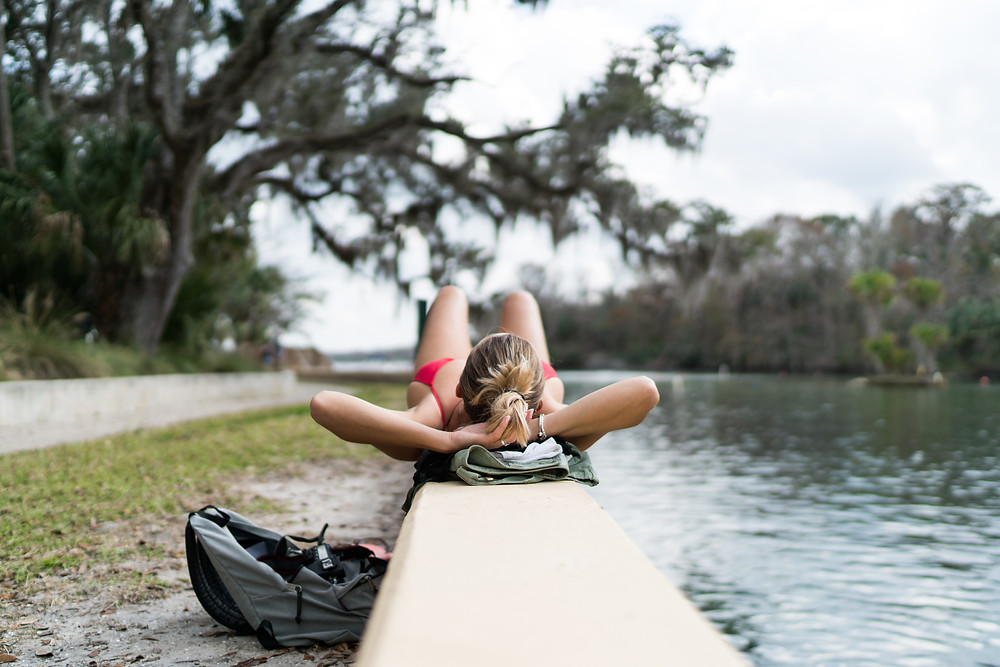 Woman laying on ledge Ocala National Forest