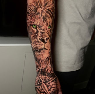 Lion and compass tattoo 