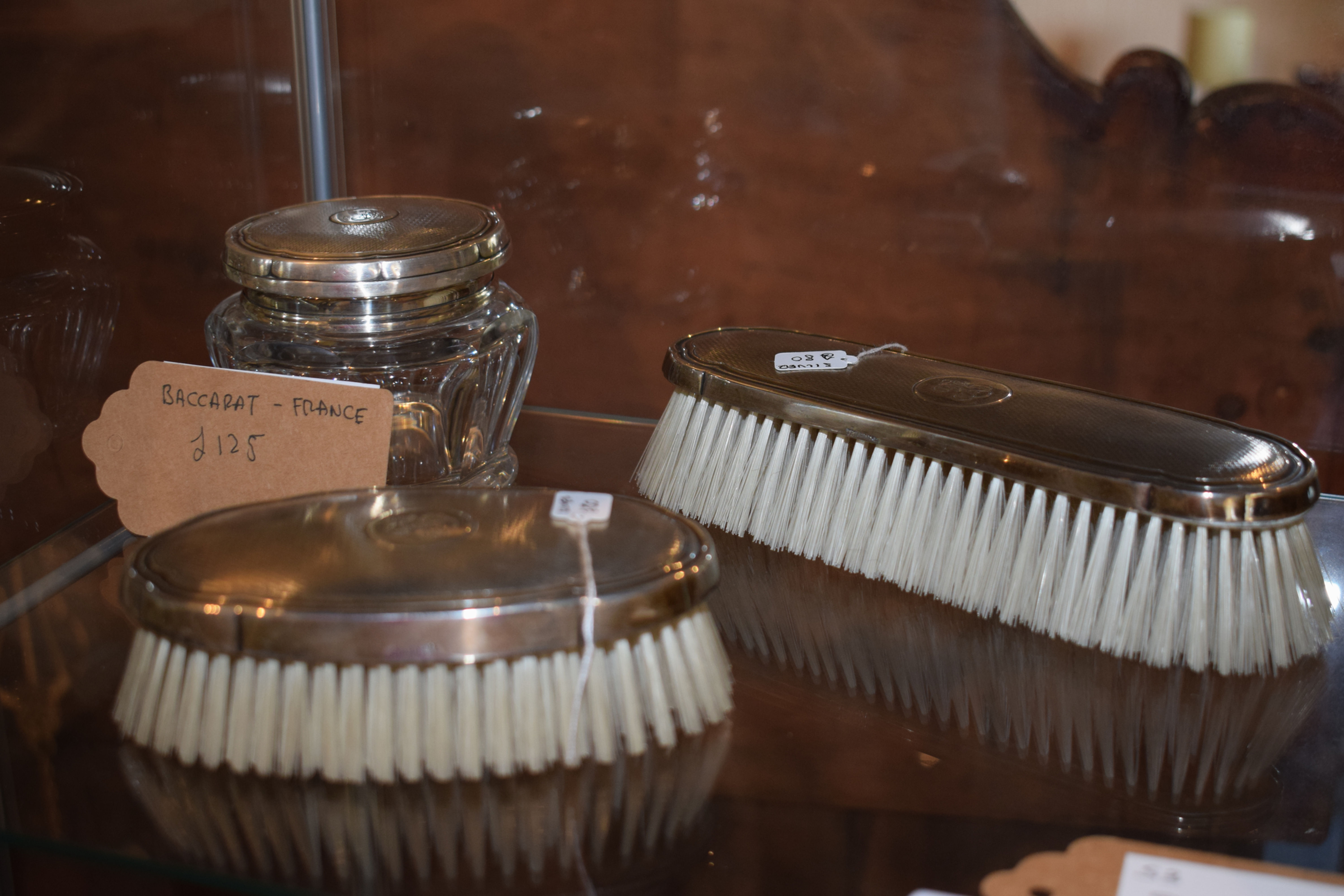 Silver plated brushes and a French Baccarat dresser pot