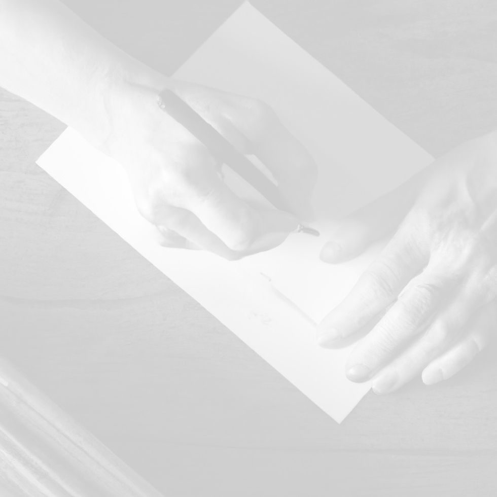 writing at an old wood desk_edited.jpg