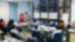 Micron team leader presenting current state value stream map analysis to team members during an OEC-facilitated VSM workshop in Singapore