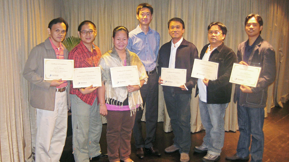 Manufacturing professionals participating in a Total Productive Maintenance TPM workshop