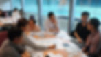 Team members engaged in structured discussion during a Kaizen workplace improvement session