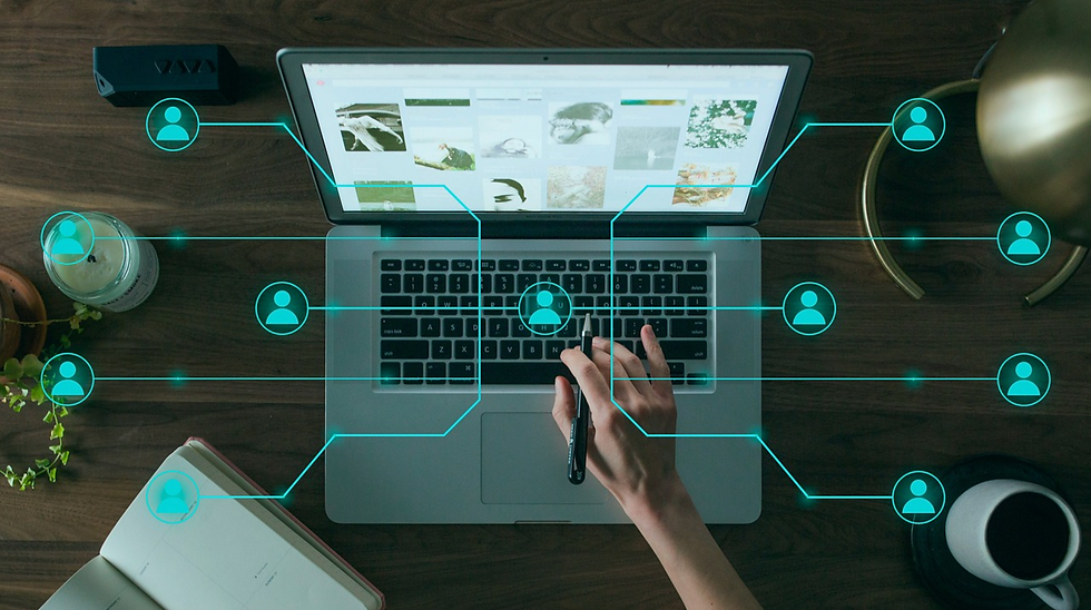 Person using a laptop with digital user icons connected across the screen, representing integrated digital customer service systems and seamless customer experience.