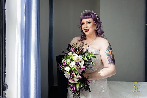 Bride with alternative bridal makeup and radiant airbrush complexion, The Manor Basket Range, red lip