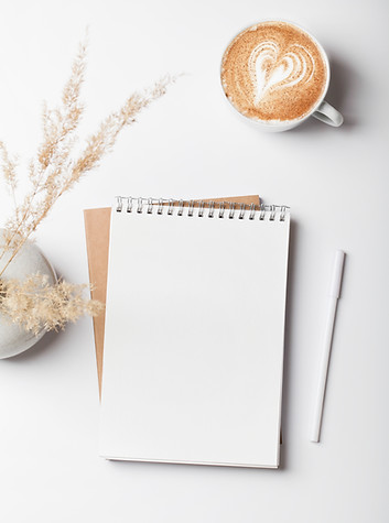 office desk workspace with notebook, pencil, coffee and pampas grass in vase. Flat lay, t
