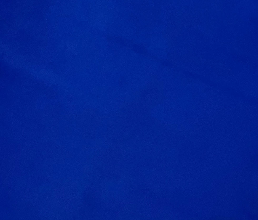 Close up of smooth textured, bright cobalt blue chrome-tanned lambskin leather