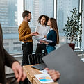 smiley-colleagues-office-meeting.jpg