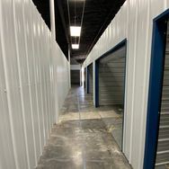 Interior view of steel wall studs and framing in a workshop