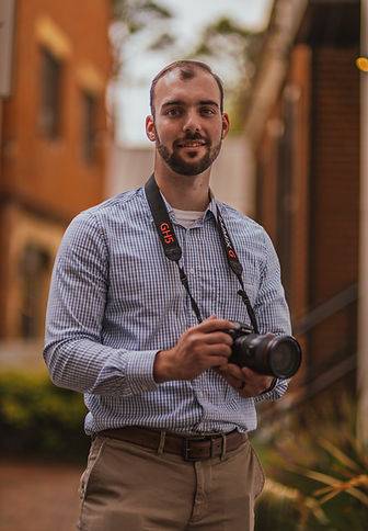 Mark Landry holding video camera