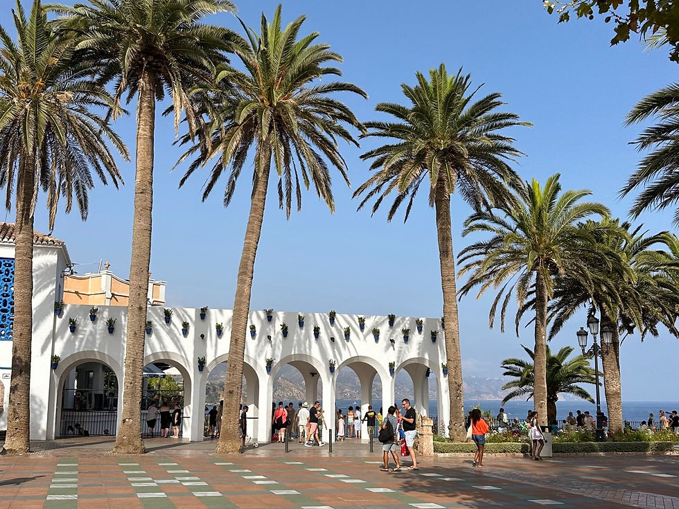 Sunny summer view from Nerja’s Balcón de Europa, overlooking the blue Mediterranean Sea