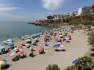 Colorful umbrellas on Playa el Salón beach in Nerja