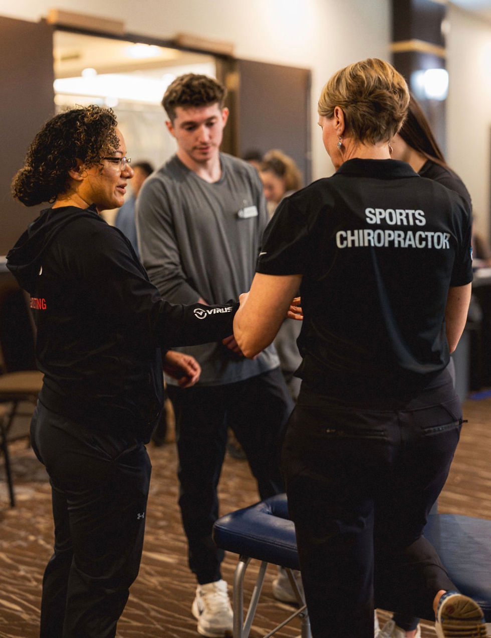 Dr. Kim in action helping athletes.