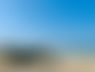 Helping fishermen pull in their boats in Varca, Goa.